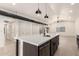 Island features modern sink and faucet and updated appliances including the dishwasher at 862 W Javelina Ave, Mesa, AZ 85210