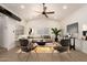 Virtually staged living room featuring neutral tones, a ceiling fan, and wood-style flooring at 862 W Javelina Ave, Mesa, AZ 85210