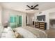 This main bedroom features a ceiling fan, ensuite bathroom, and sliding glass doors at 862 W Javelina Ave, Mesa, AZ 85210