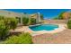Backyard swimming pool with desert landscaping and small trees in a private backyard at 862 W Javelina Ave, Mesa, AZ 85210