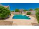 Private pool surrounded by mature landscaping and a concrete patio, ideal for outdoor relaxation and entertainment at 862 W Javelina Ave, Mesa, AZ 85210