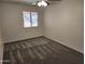 Bright and airy bedroom with plush carpet and a large window, offering a relaxing retreat at 8940 W Olive Ave # 39, Peoria, AZ 85345