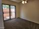 Cozy bedroom with a sliding glass door and a ceiling fan for added comfort at 8940 W Olive Ave # 39, Peoria, AZ 85345