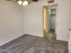 Comfortable bedroom with carpet flooring, ceiling fan, and convenient access to a walk-in closet at 8940 W Olive Ave # 39, Peoria, AZ 85345