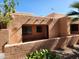 Exterior of home featuring stucco walls, desert landscaping and partially covered patio at 8940 W Olive Ave # 39, Peoria, AZ 85345