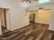 Open-concept living room featuring wood floors, modern lighting, and an open floor plan at 8940 W Olive Ave # 39, Peoria, AZ 85345