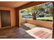 View from covered patio of landscaped yard, trees and parking area at 8940 W Olive Ave # 39, Peoria, AZ 85345