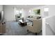 Bright living room featuring modern furniture, a large window, and neutral tones at 9837 W Odeum Ln, Tolleson, AZ 85353
