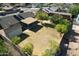 Large backyard featuring mature trees and a covered patio, ideal for relaxation and entertainment at 10910 N 72Nd Dr, Peoria, AZ 85345