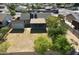 Expansive backyard with a covered patio, shed, and mature trees, offering ample space for outdoor activities at 10910 N 72Nd Dr, Peoria, AZ 85345
