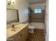 Bathroom view featuring a tub, shower, toilet, and vanity at 10910 N 72Nd Dr, Peoria, AZ 85345