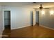 This bedroom has a hardwood floor and two entrances to walk-in closets at 10910 N 72Nd Dr, Peoria, AZ 85345