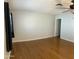 Bedroom with neutral walls, hardwood floors, ceiling fan, and lots of open space at 10910 N 72Nd Dr, Peoria, AZ 85345