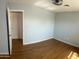 Spacious bedroom featuring beautiful hardwood floors and neutral, freshly-painted walls at 10910 N 72Nd Dr, Peoria, AZ 85345