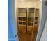 Unique closet has mirrored doors and many shelves for storage at 10910 N 72Nd Dr, Peoria, AZ 85345