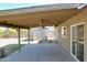 Inviting covered patio with a ceiling fan, perfect for enjoying the outdoors in comfort and style at 10910 N 72Nd Dr, Peoria, AZ 85345