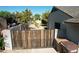 Stylish wooden gate providing privacy and security to the backyard at 10910 N 72Nd Dr, Peoria, AZ 85345