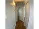 Hallway view featuring wood floors and neutral wall color at 10910 N 72Nd Dr, Peoria, AZ 85345