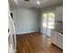 Well-lit kitchen with hardwood floors and sliding door access to back porch and yard at 10910 N 72Nd Dr, Peoria, AZ 85345