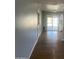 View of the kitchen area featuring hardwood floors and sliding glass doors to the backyard at 10910 N 72Nd Dr, Peoria, AZ 85345