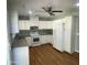 Bright kitchen with white cabinets, modern appliances, and ample counter space at 10910 N 72Nd Dr, Peoria, AZ 85345
