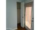 Living room with hardwood floors, large closet and back door with window covering at 10910 N 72Nd Dr, Peoria, AZ 85345