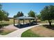 An aerial view shows a covered park pavilion with picnic tables, perfect for outdoor gatherings at 10910 N 72Nd Dr, Peoria, AZ 85345