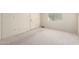 An empty bedroom with neutral carpet and a view to a door at 11026 N 28Th Dr # 81, Phoenix, AZ 85029
