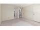 An open bedroom with neutral carpet, a closet and neutral walls at 11026 N 28Th Dr # 81, Phoenix, AZ 85029