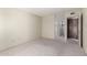 The open bedroom has neutral carpet, and view to the bathroom at 11026 N 28Th Dr # 81, Phoenix, AZ 85029