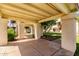 Covered carport area offering sheltered parking with manicured landscaping and green space at 11026 N 28Th Dr # 81, Phoenix, AZ 85029
