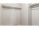 An empty closet with neutral carpet and a single rail at 11026 N 28Th Dr # 81, Phoenix, AZ 85029