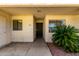 Welcoming entrance with textured walls, security door, and manicured landscaping at 11026 N 28Th Dr # 81, Phoenix, AZ 85029