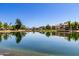 Picturesque lakefront residences with a scenic view of the tranquil water and lush greenery at 11026 N 28Th Dr # 81, Phoenix, AZ 85029