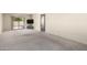 Bright living area with glass sliding doors and neutral carpeting creating a relaxing space at 11026 N 28Th Dr # 81, Phoenix, AZ 85029