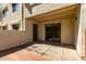 Inviting outdoor patio with brick accents and sliding door access to indoor living spaces at 11026 N 28Th Dr # 81, Phoenix, AZ 85029
