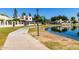 Scenic view of the serene pond, a sidewalk, and surrounding greenery, ideal for leisurely strolls at 11026 N 28Th Dr # 81, Phoenix, AZ 85029