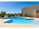 Relaxing community pool with clear blue water, poolside seating and well-maintained landscaping at 11026 N 28Th Dr # 81, Phoenix, AZ 85029