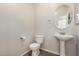 Stylish half-bathroom featuring classic fixtures and neutral decor, perfect for guests at 11871 W Sherman St, Avondale, AZ 85323