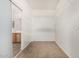 Spacious walk-in closet featuring wire shelving and neutral tile flooring at 11871 W Sherman St, Avondale, AZ 85323