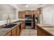 Modern kitchen featuring stainless steel appliances and a central island, designed for functionality and style at 11871 W Sherman St, Avondale, AZ 85323