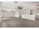 Large upstairs loft area with neutral carpet and multiple ceiling fans at 11871 W Sherman St, Avondale, AZ 85323
