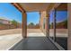 Covered patio overlooking spacious backyard, perfect for entertaining at 11871 W Sherman St, Avondale, AZ 85323