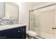 Modern bathroom features a glass shower door and a sink with blue tile accents at 1222 W Baseline Rd # 119, Tempe, AZ 85283