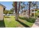 Manicured lawn and tree-lined street, exuding curb appeal at 1222 W Baseline Rd # 119, Tempe, AZ 85283