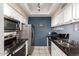 Kitchen featuring sleek countertops, stainless steel appliances, and lots of storage at 1222 W Baseline Rd # 119, Tempe, AZ 85283