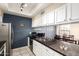 Kitchen featuring sleek countertops, stainless steel appliances, and lots of storage at 1222 W Baseline Rd # 119, Tempe, AZ 85283
