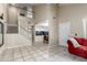 Bright living space featuring tile floors that lead to the adjacent kitchen and dining area at 1222 W Baseline Rd # 119, Tempe, AZ 85283