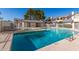 Community pool with crystal clear water and surrounding lounge area, perfect for relaxation and recreation at 1222 W Baseline Rd # 119, Tempe, AZ 85283
