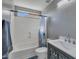 Charming bathroom featuring new vanity with white marble countertop, shower with curtain and modern fixtures at 12720 W Cantenia Rd, Avondale, AZ 85392